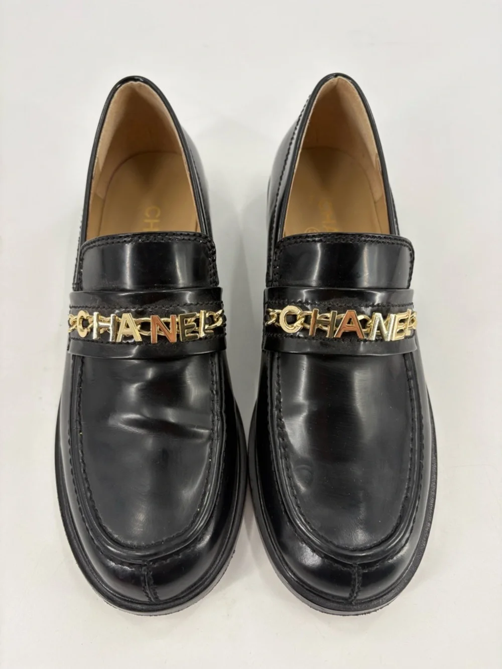 CHANEL Black Leather Loafers with Gold Logo Chain